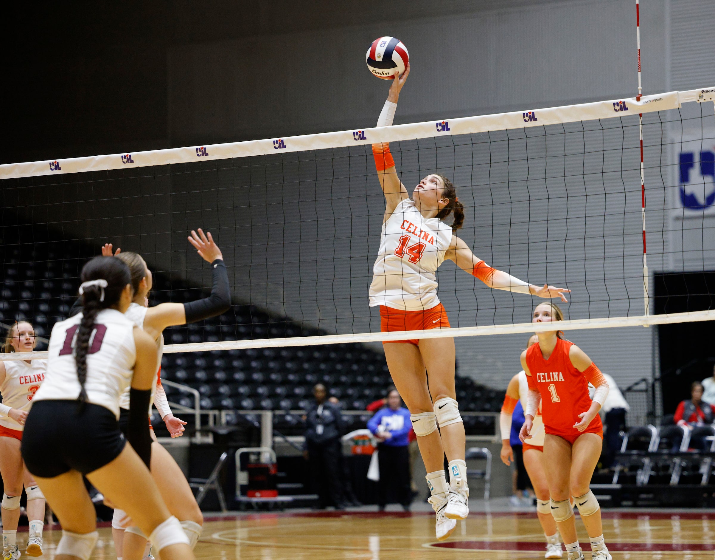 Celina's Kennedy Hangartner (14) spikes the ball during a UIL class 4A volleyball state...