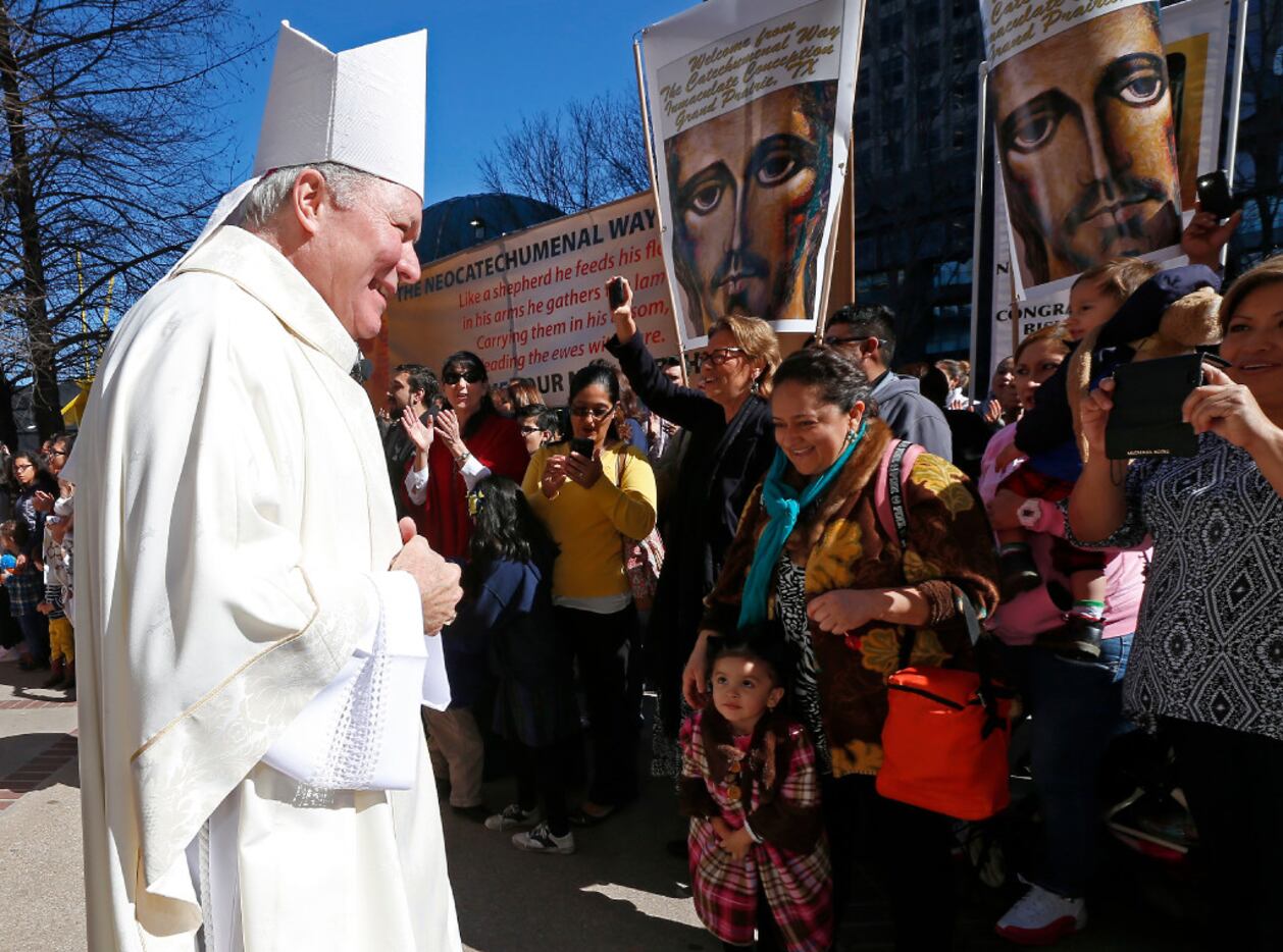 Bishop Edward J. Burns looks at the crowd in the procession outside Cathedral Shrine of the...