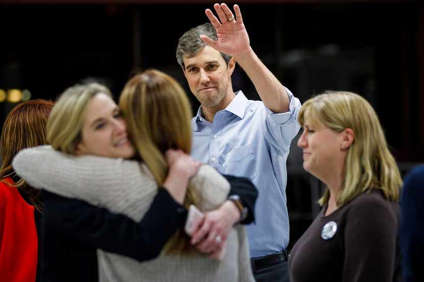 U.S. Representative Beto O'Rourke (D-El Paso) waves to supporters after he addressed a town...