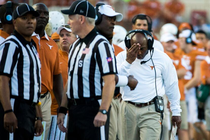 Texas head coach Charlie Strong reacts after safety Dylan Haines was ejected from the game...