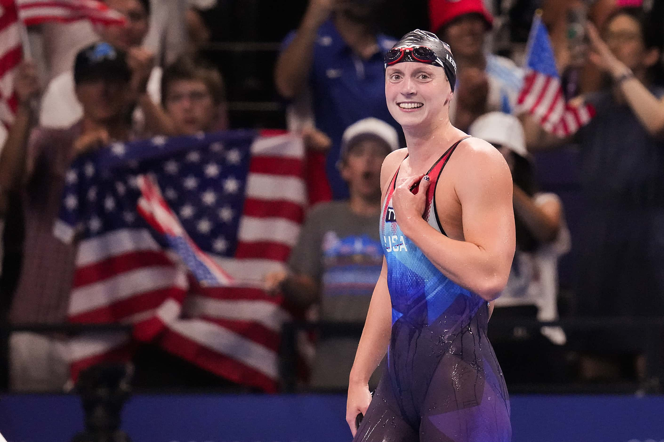 Katie Ledecky of the United States celebrates after winning the women's 1500-meter freestyle...