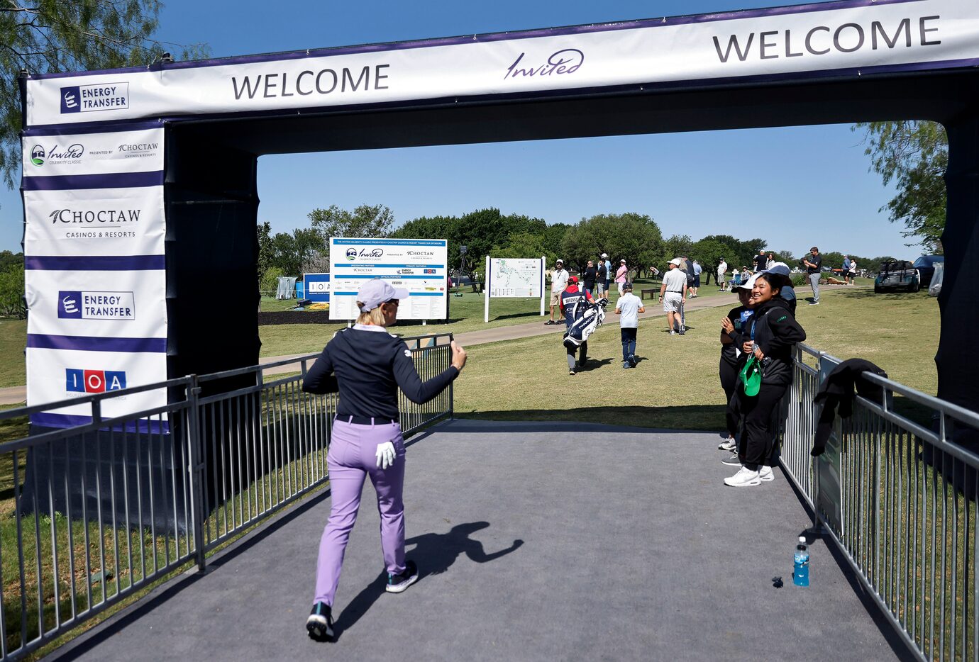 Retired LPGA golfer Annika Sorenstam (left) acknowledges the vocal support form female fans...