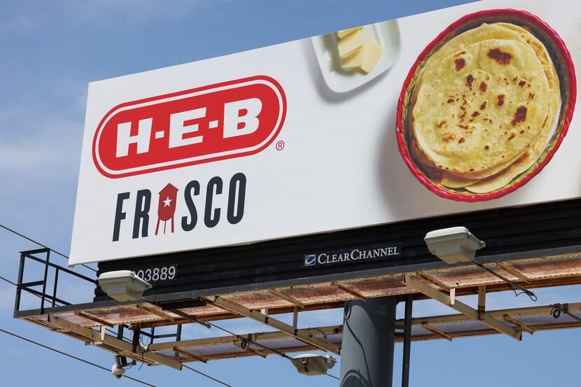 Billboards along the Dallas North Tollway advertise the H-E-B opening soon in Frisco.