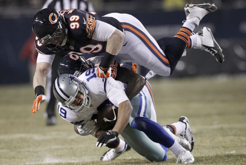 Dallas Cowboys wide receiver Miles Austin (19) is tackled by Chicago Bears cornerback Zack...