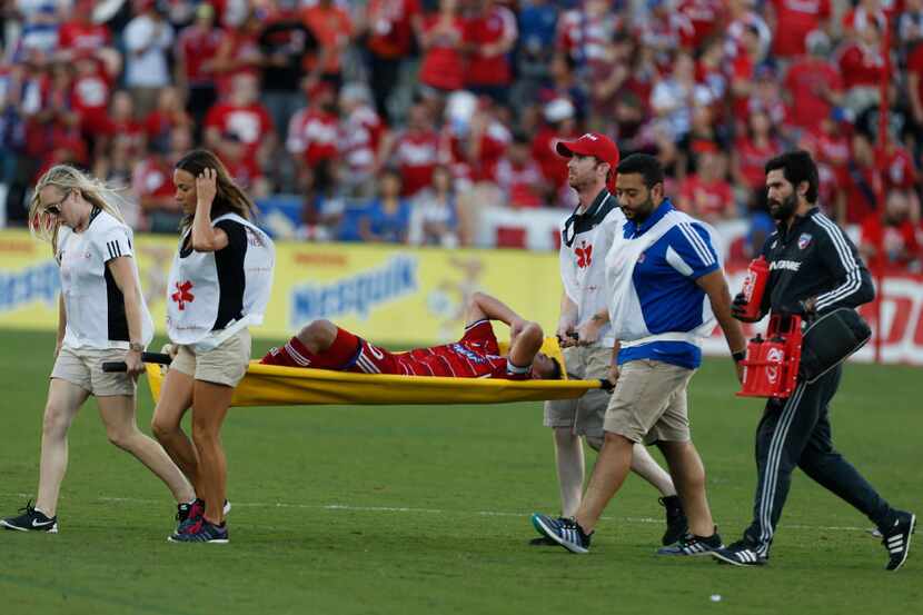 FC Dallas midfielder Mauro Diaz (10) is taken out on a stretcher in the second half at...