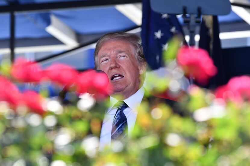 President Donald Trump addresses the US Naval Academy graduating class Friday in Annapolis,...