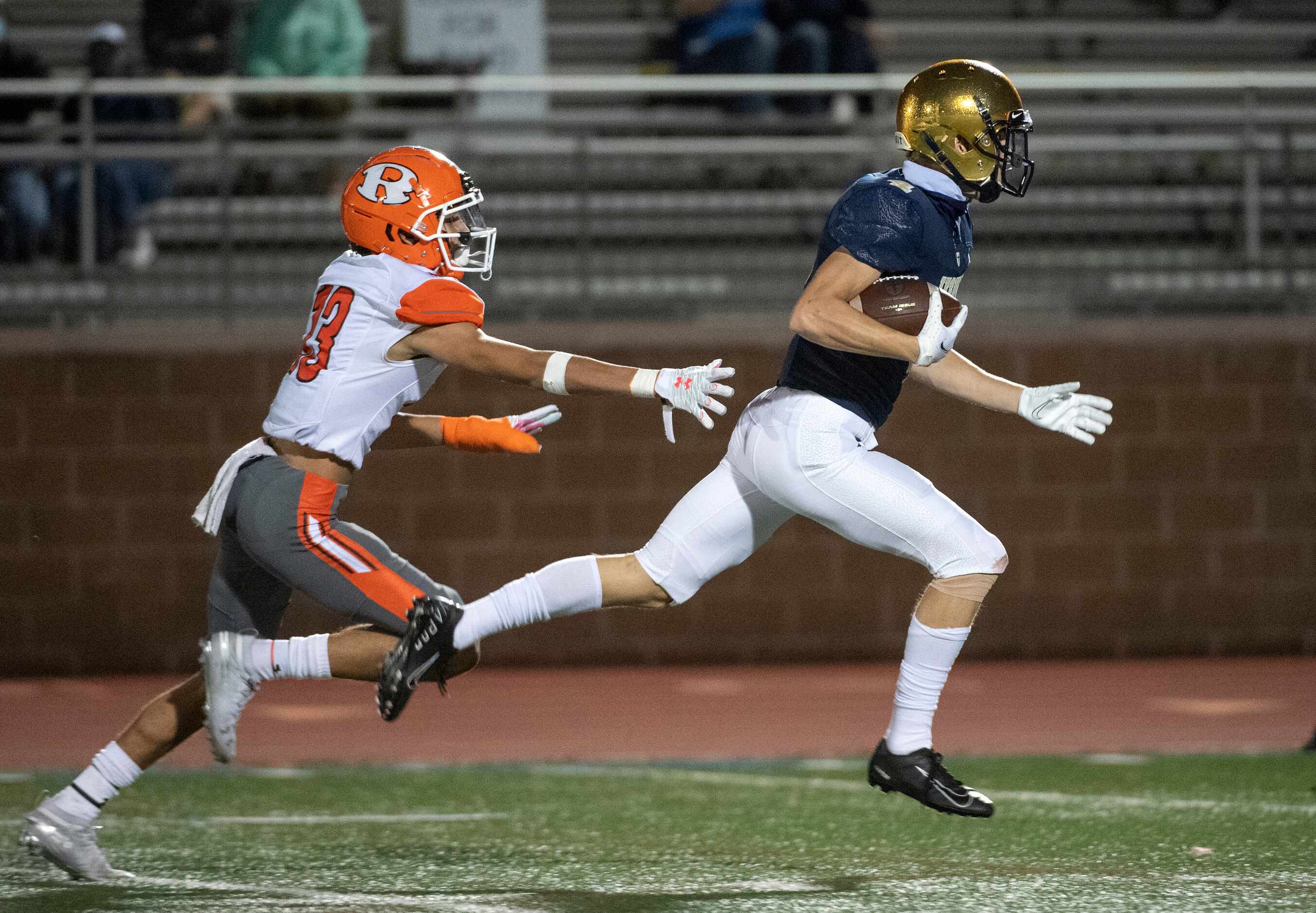 Jesuit junior wide receiver Cole Younger (4) races away from Rockwall junior defensive back...