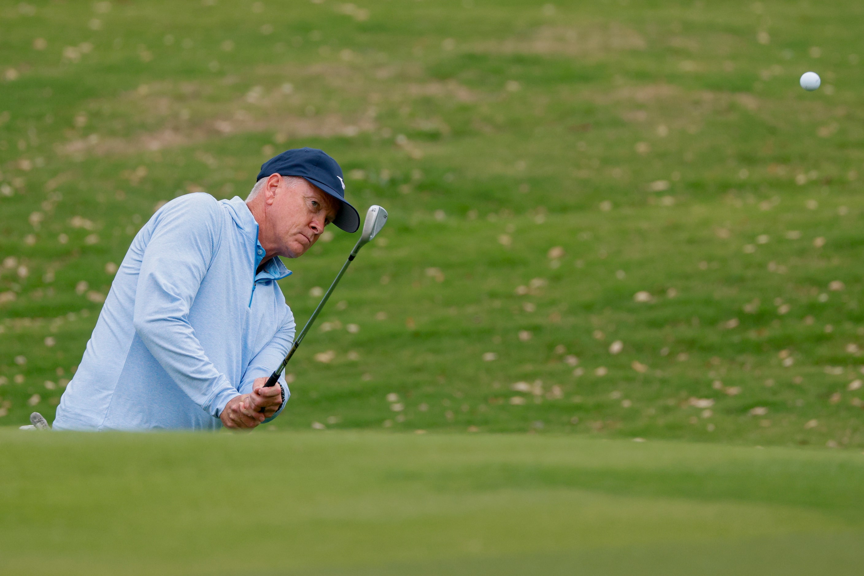 Former MLB pitcher Tom Glavine chips onto the 9th green during the first round of the...