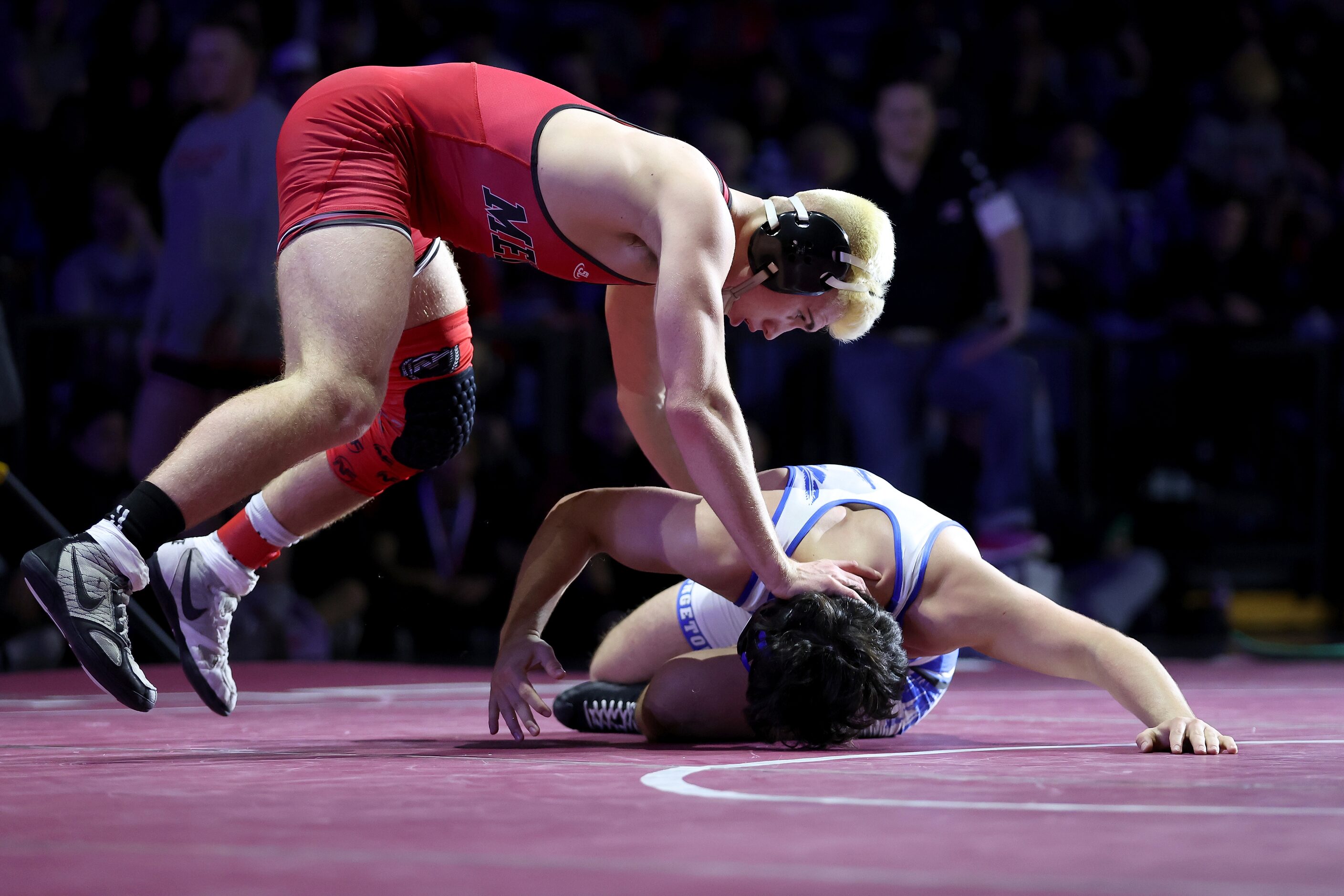 Angelo Ferrari of Melissa (red) competes against Isaac Zapata of Georgetown in the Boys 5A...