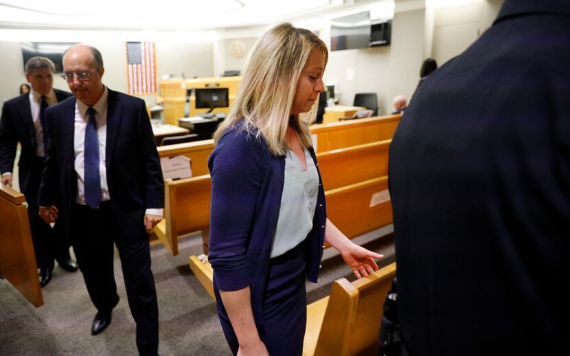 Fired Dallas police Officer Amber Guyger leaves the courtroom after she was found guilty of...