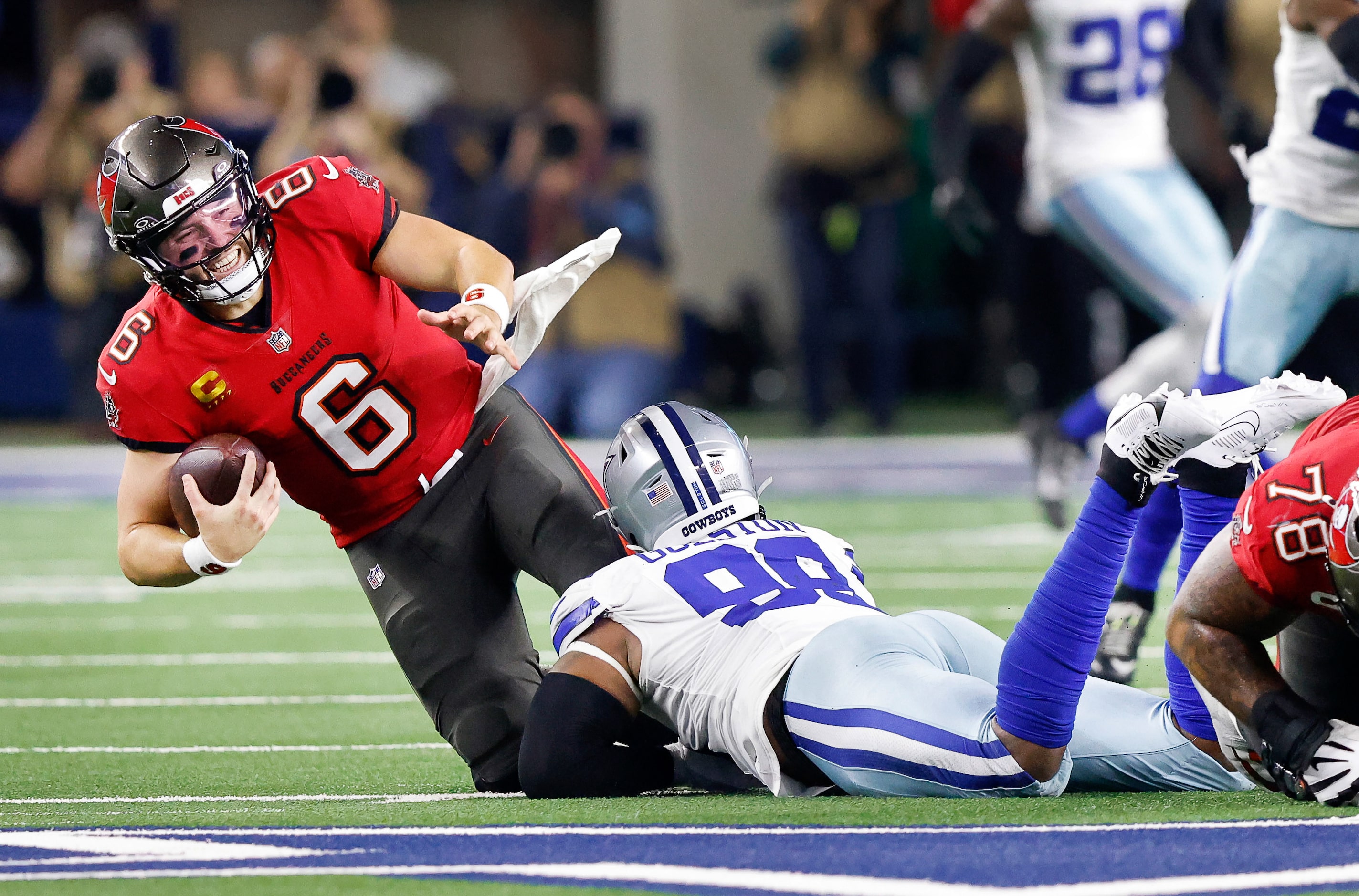 Dallas Cowboys defensive end Chauncey Golston (99) sacks Tampa Bay Buccaneers quarterback...