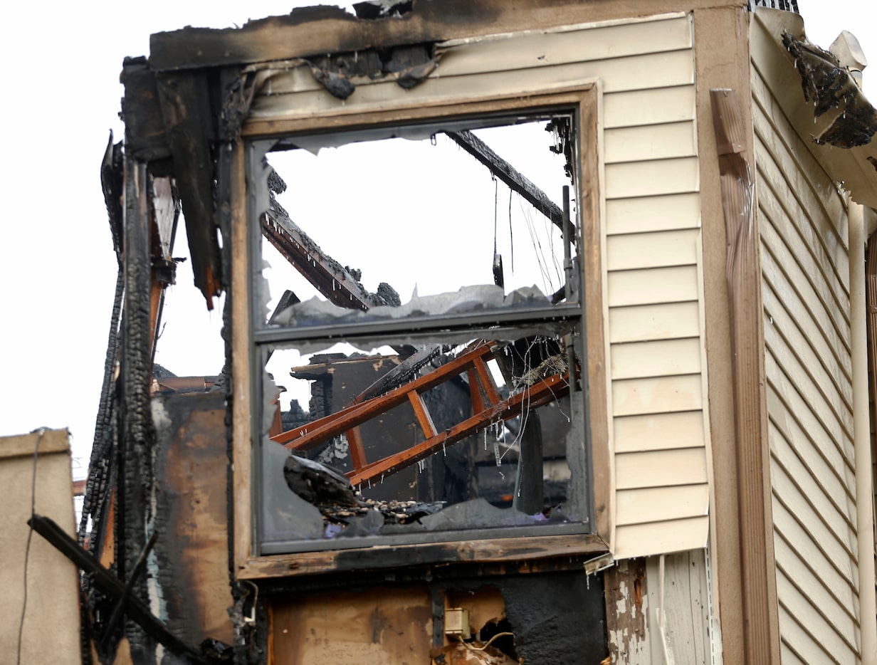 Dallas firefighters work on putting a fire out at an apartment complex  at 7229 Holly Hill...