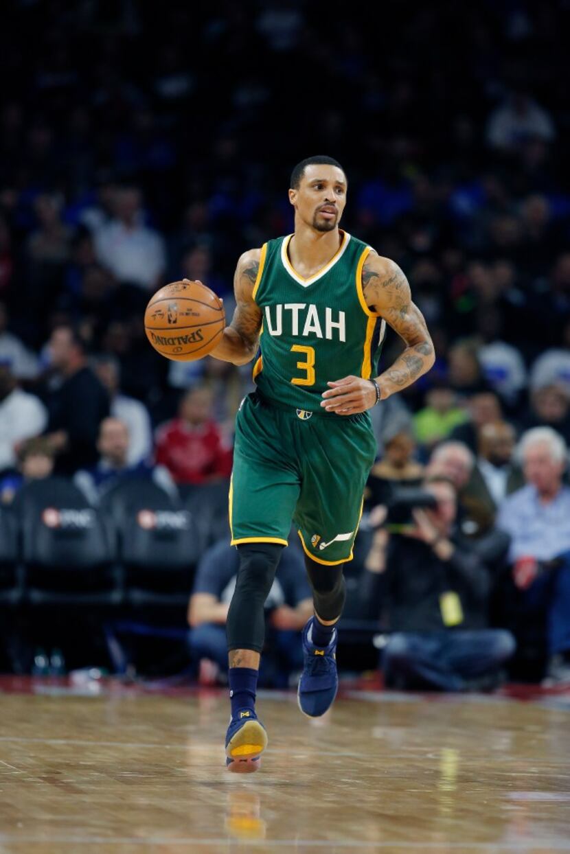 Utah Jazz guard George Hill brings the ball up court during the first half of an NBA...