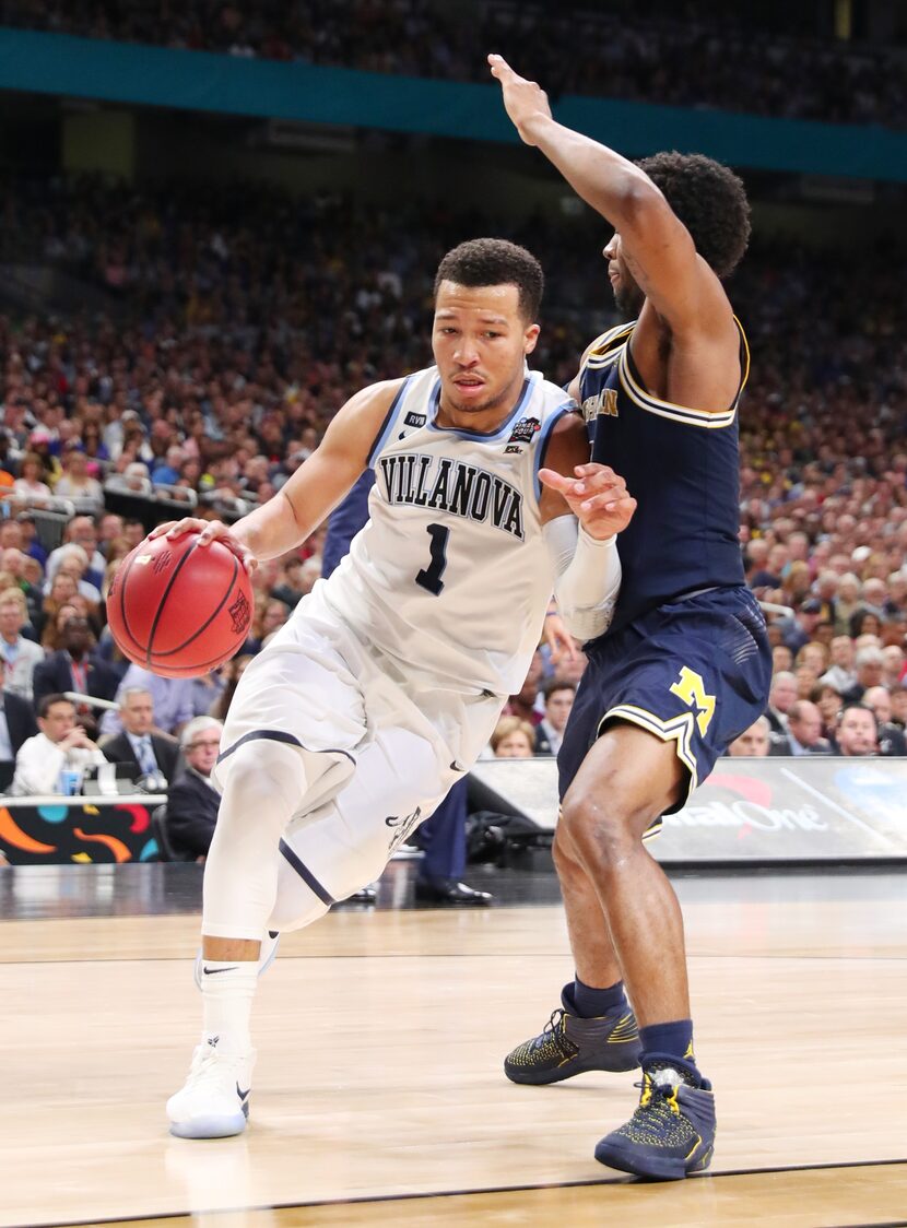 SAN ANTONIO, TX - APRIL 02: Jalen Brunson #1 of the Villanova Wildcats is defended by Zavier...