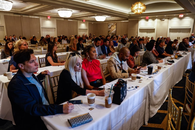 Real estate agents listen to Frisco Mayor and real estate broker Jeff Cheney and...