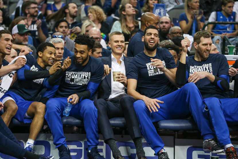 With Kristaps Porzingis seated center, the Dallas Mavericks joke around prior to the first...