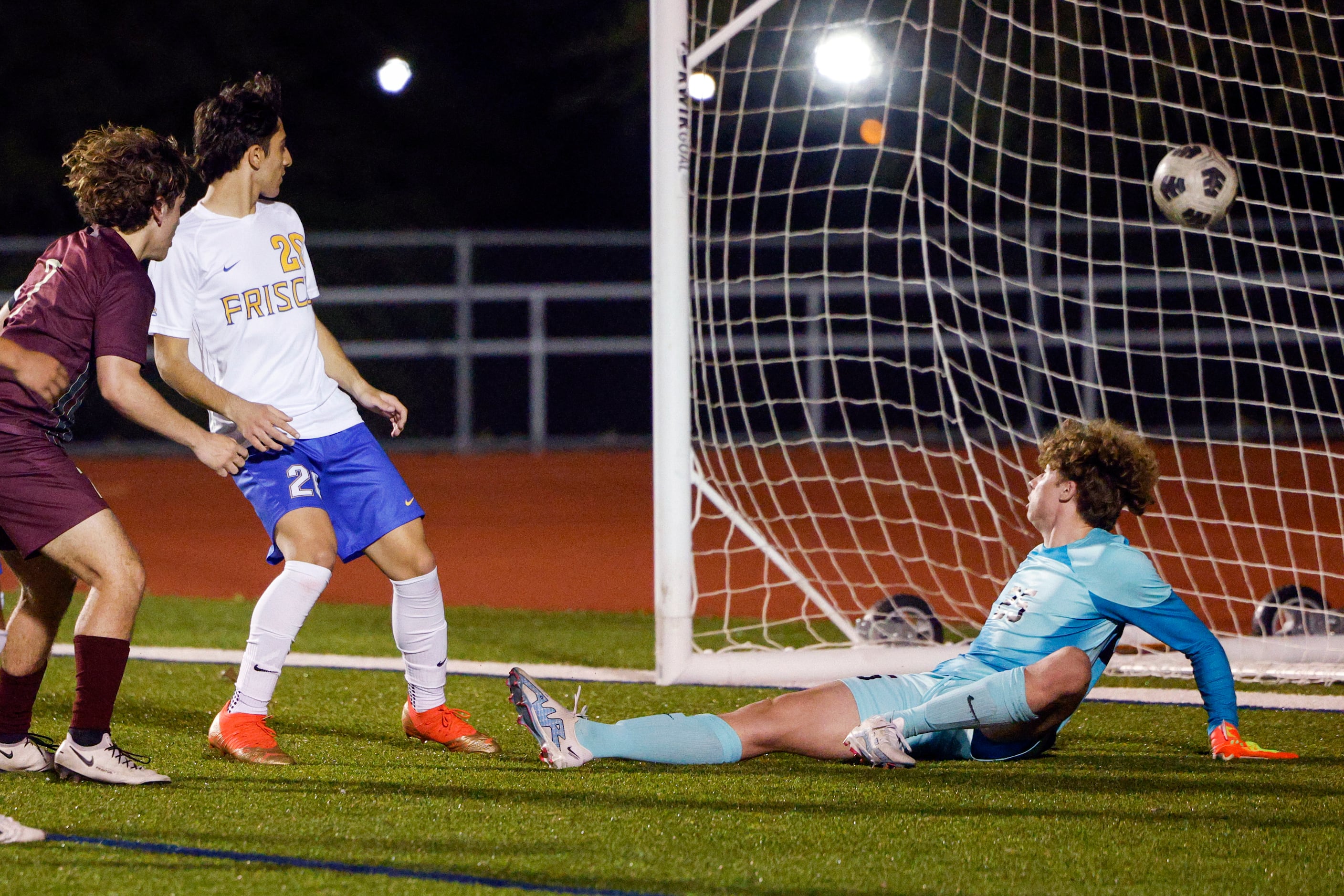 Frisco goalkeeper Benjamin Bauer (25) watches as a shot from Frisco Heritage forward Omar...
