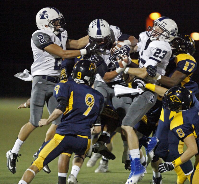 The Prestonwood Christian Academy kickoff team closes in on Liberty High School's Matt Marrs...