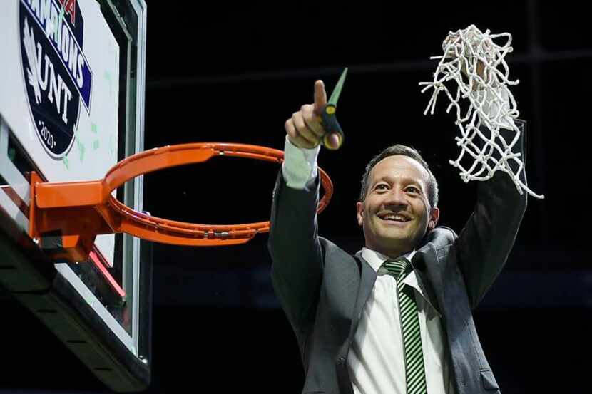 North Texas men’s basketball coach Grant McCasland cuts down the net after the Mean Green...