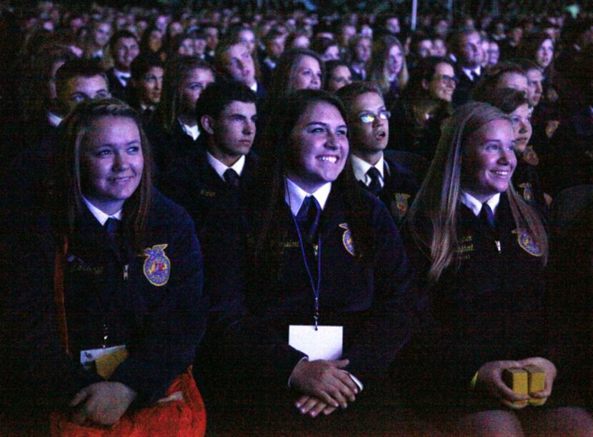 Hannah Ford (center), 18, of Peaster, with fellow FFA members Candace Schiegg (left) and...