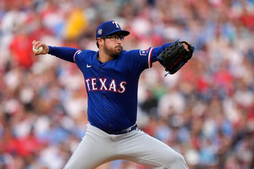 Texas Rangers' Dane Dunning pitches during the second inning of a baseball game against the...