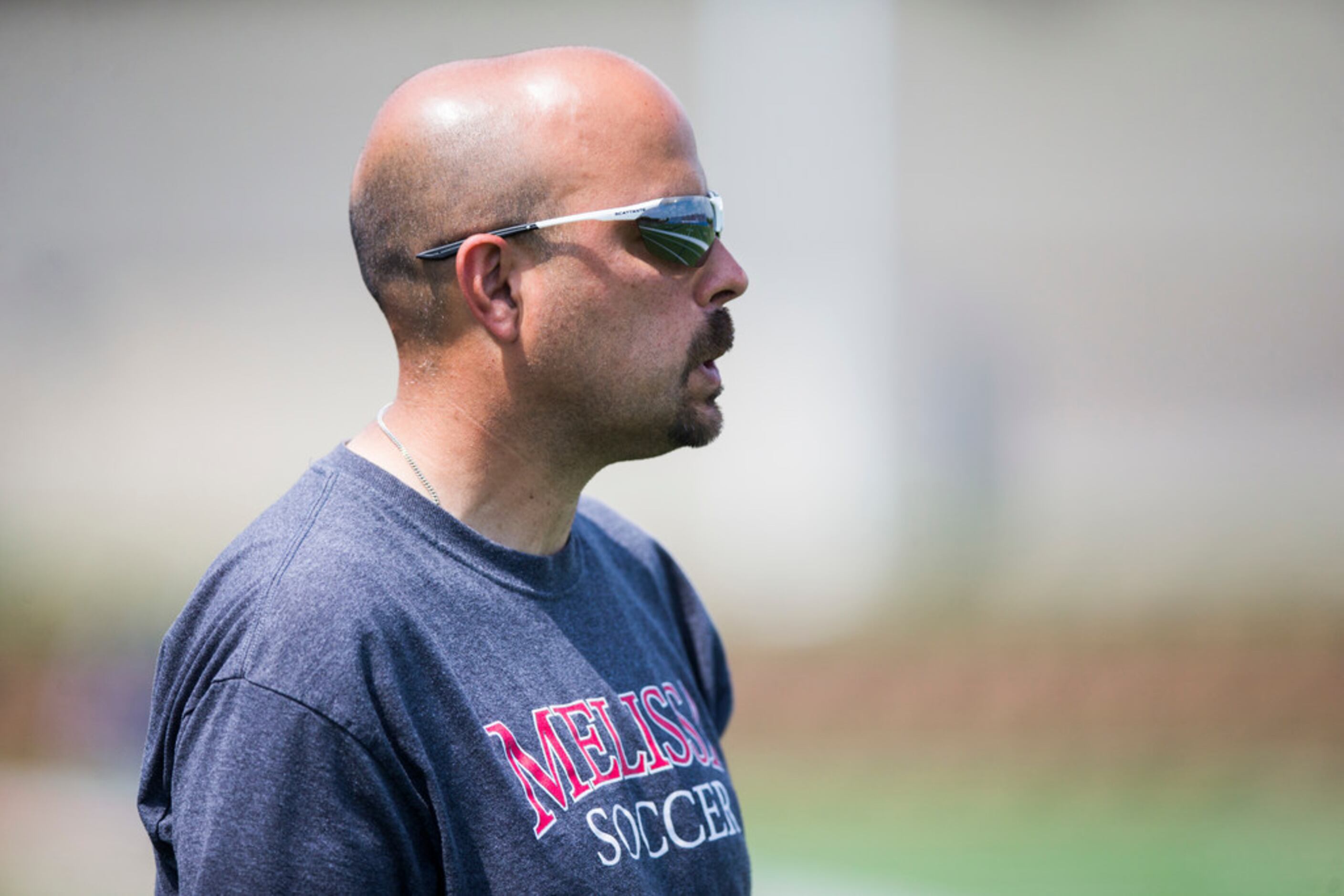 Melissa head coach Manuel Avila watches from the sideline during the second half of a UIL...