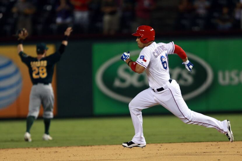 Texas Rangers  Robinson Chirinos runs to second on a deep double in the ninth inning of play...
