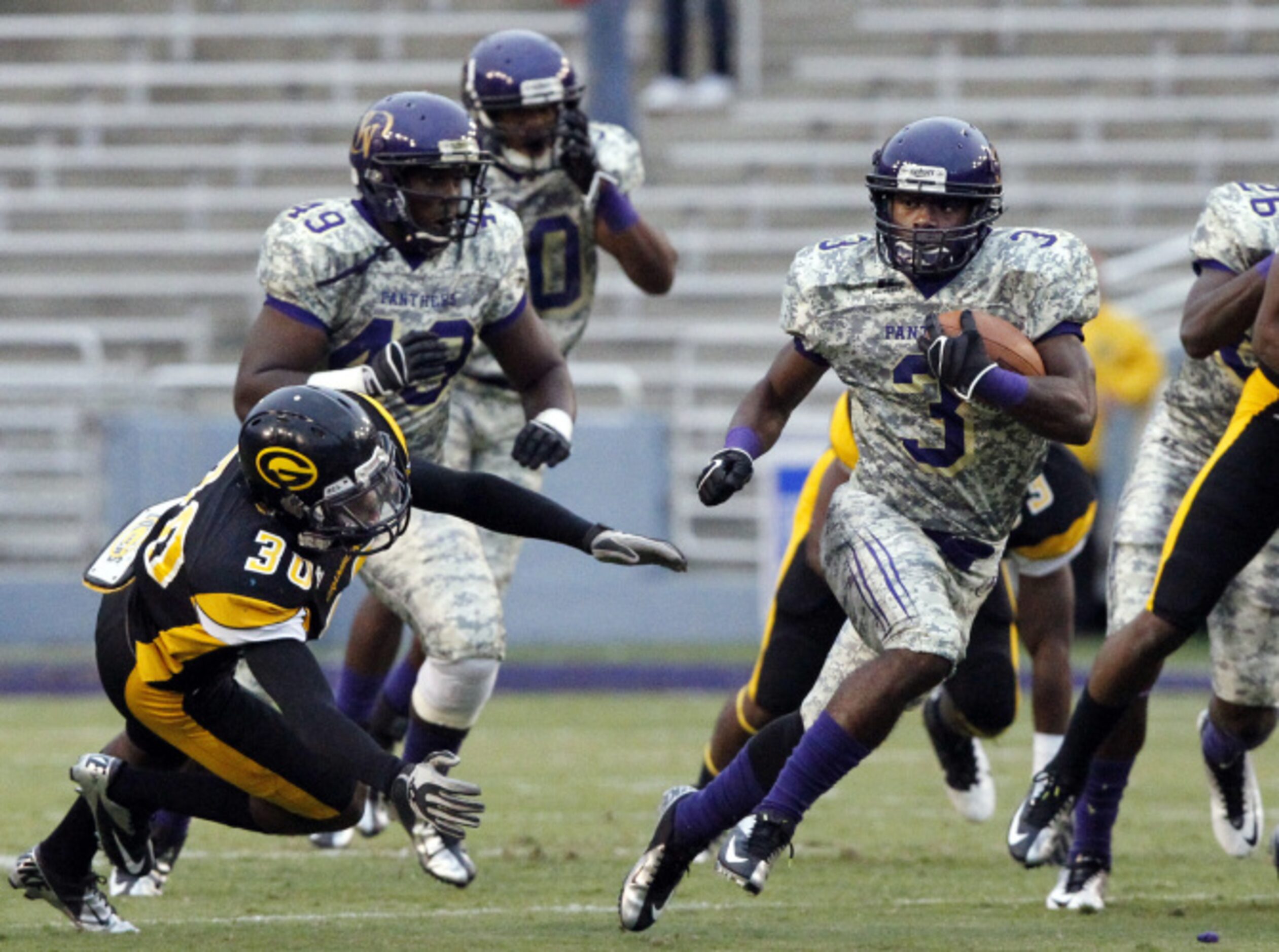 Prairie View A&M running back Johnta Hebert (3) can't be stopped by Grambling defensive back...