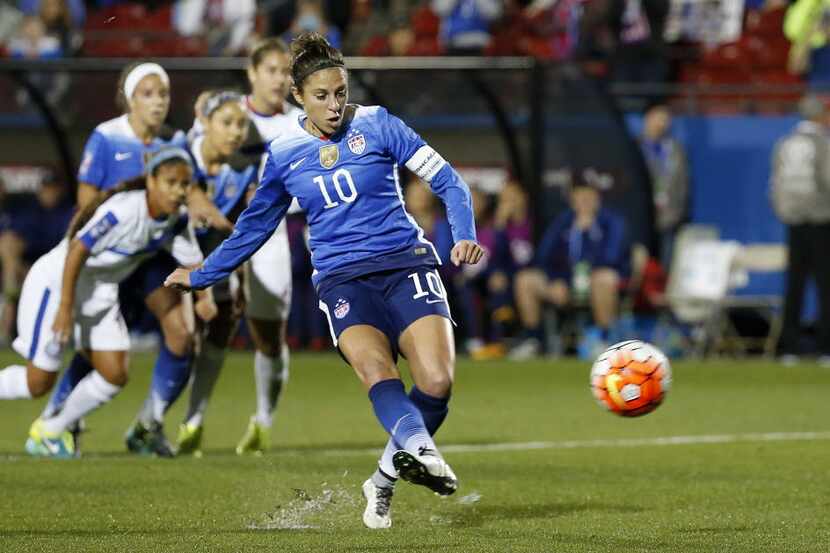 United States midfielder Carli Lloyd (10) scores a goal on a penalty kick against Puerto...