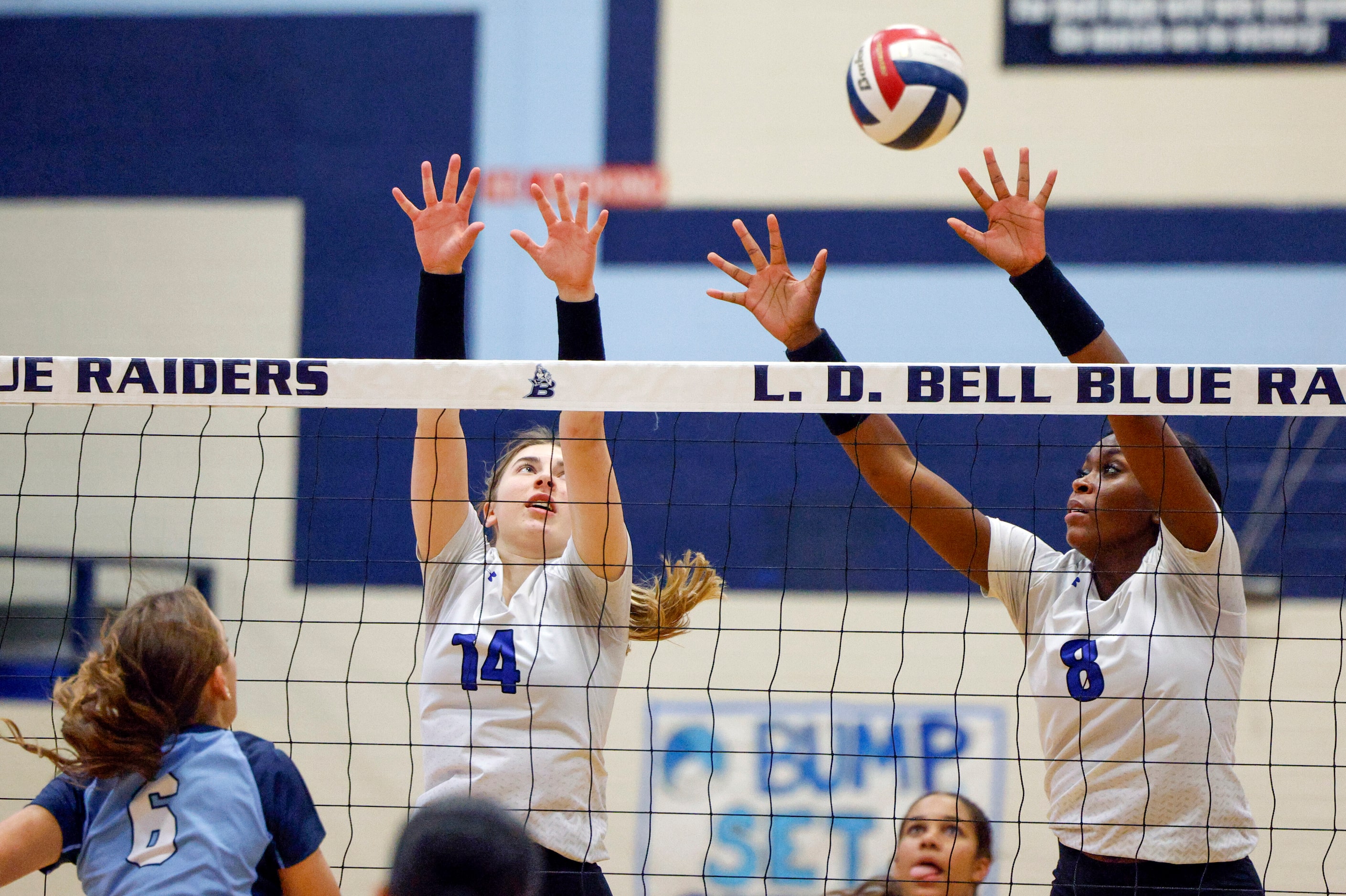 Trophy Club Byron Nelson's Lexi Proctor (14) and Rayvyn Thomas (8) jump to try and block a...