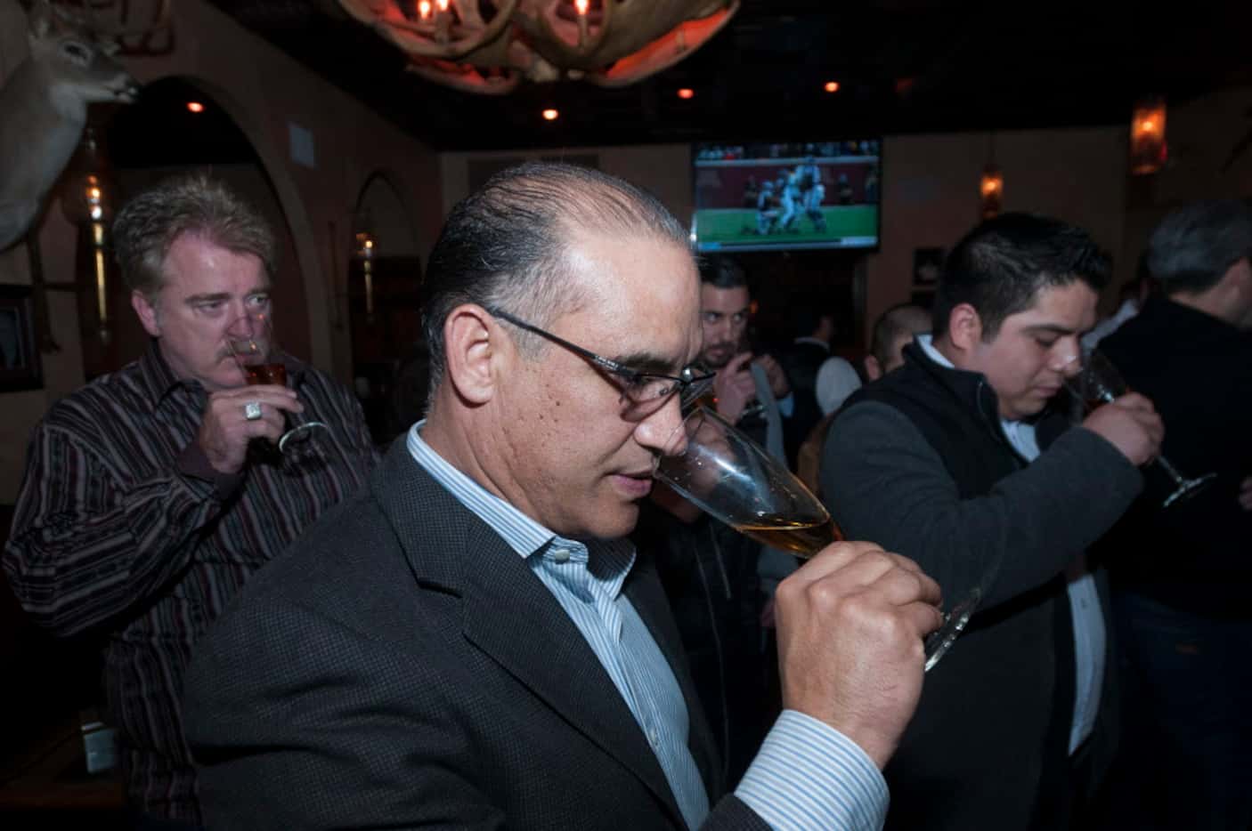 Jaime Rodriguez, with Proximo Spirits, sniffs tequila during a tasting held by Jose Cuervo...