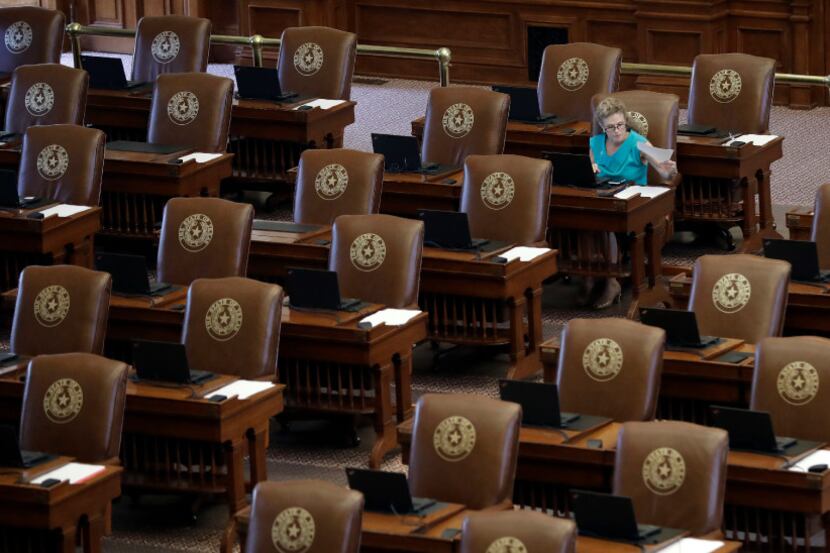Texas Rep. Donna Howard, D-Austin, worked at her desk as she waited for the House to convene...