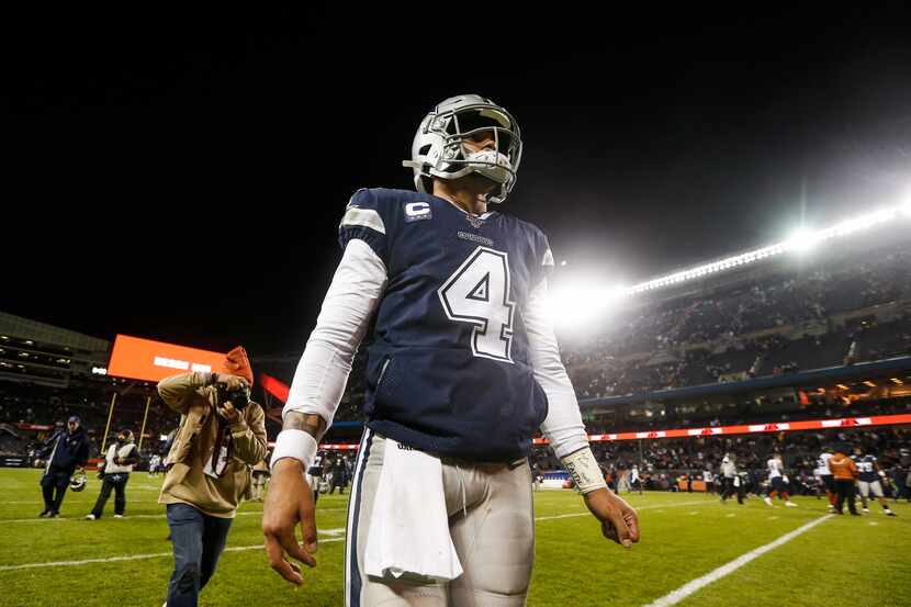 FILE - Cowboys quarterback Dak Prescott (4) walks off the field following a 31-24 loss to...