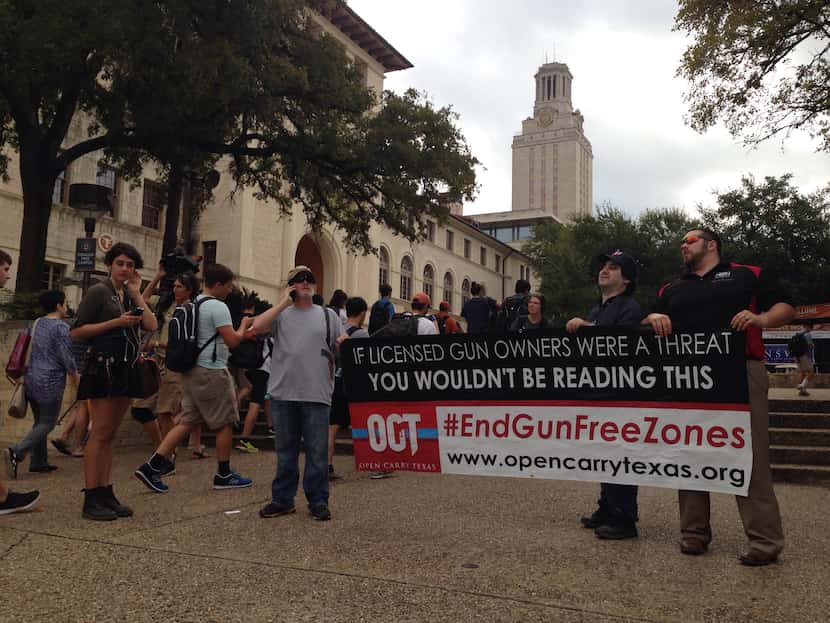 Gun-rights advocates from Open Carry Texas, including leader C.J. Grisham (left), were in...