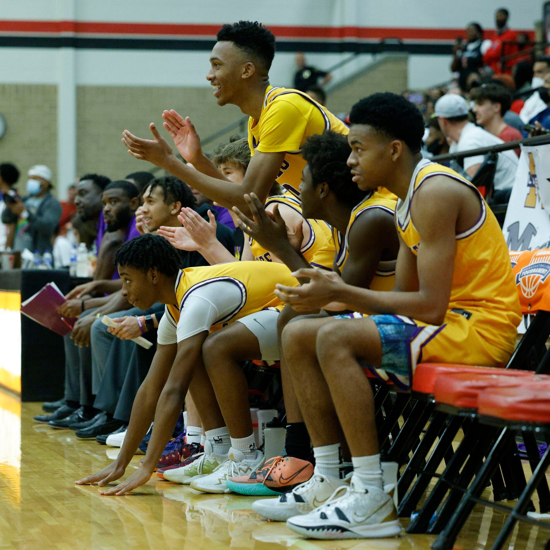 The Richardson bench celebrates a basket during overtime of the Whataburger boys basketball...