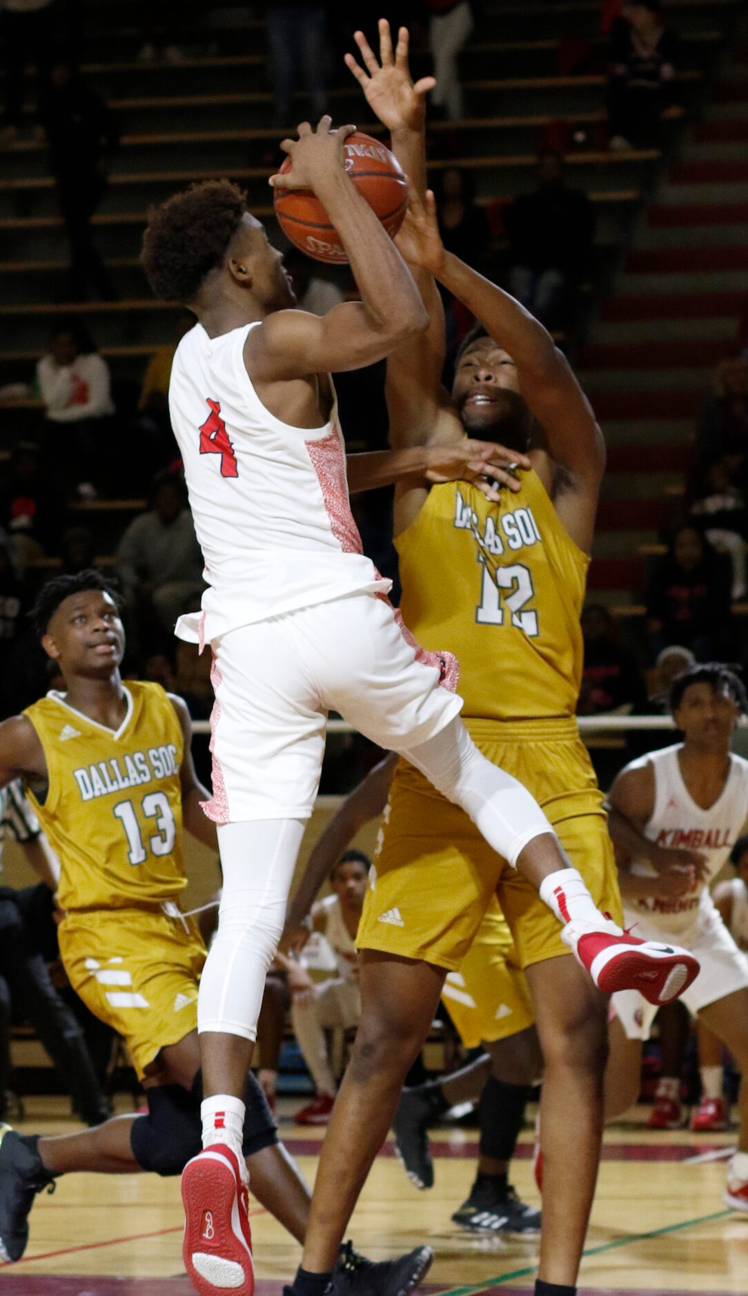 Dallas Kimball's Arterio Morris (4) drives to the basket as he is defended by Dallas South...