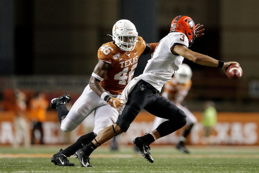 AUSTIN, TX - SEPTEMBER 21:  Spencer Sanders #3 of the Oklahoma State Cowboys rolls out to...