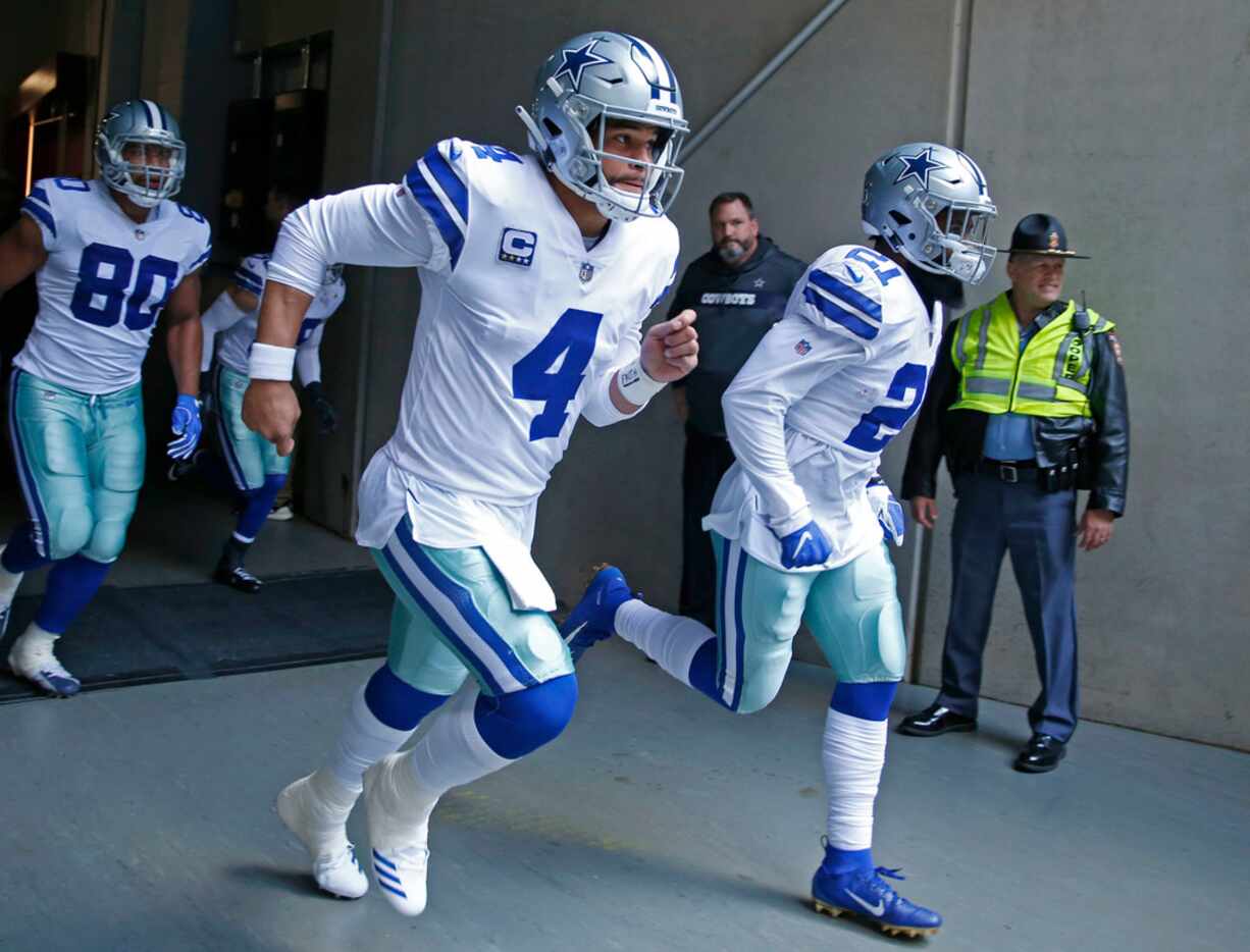 Dallas Cowboys quarterback Dak Prescott (4) and Dallas Cowboys running back Ezekiel Elliott...