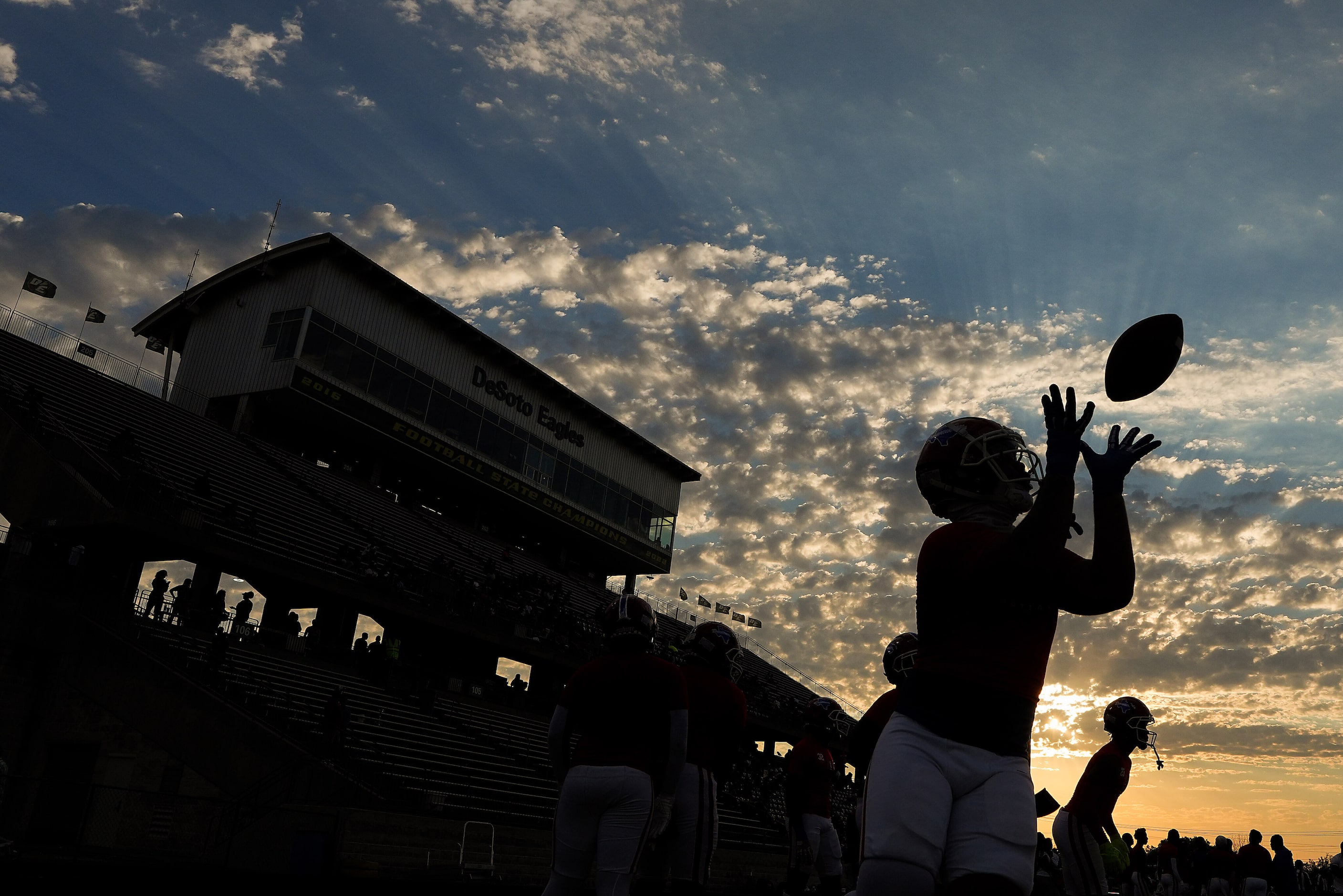 Duncanville players warm up before a District 11-6A high school football game against DeSoto...