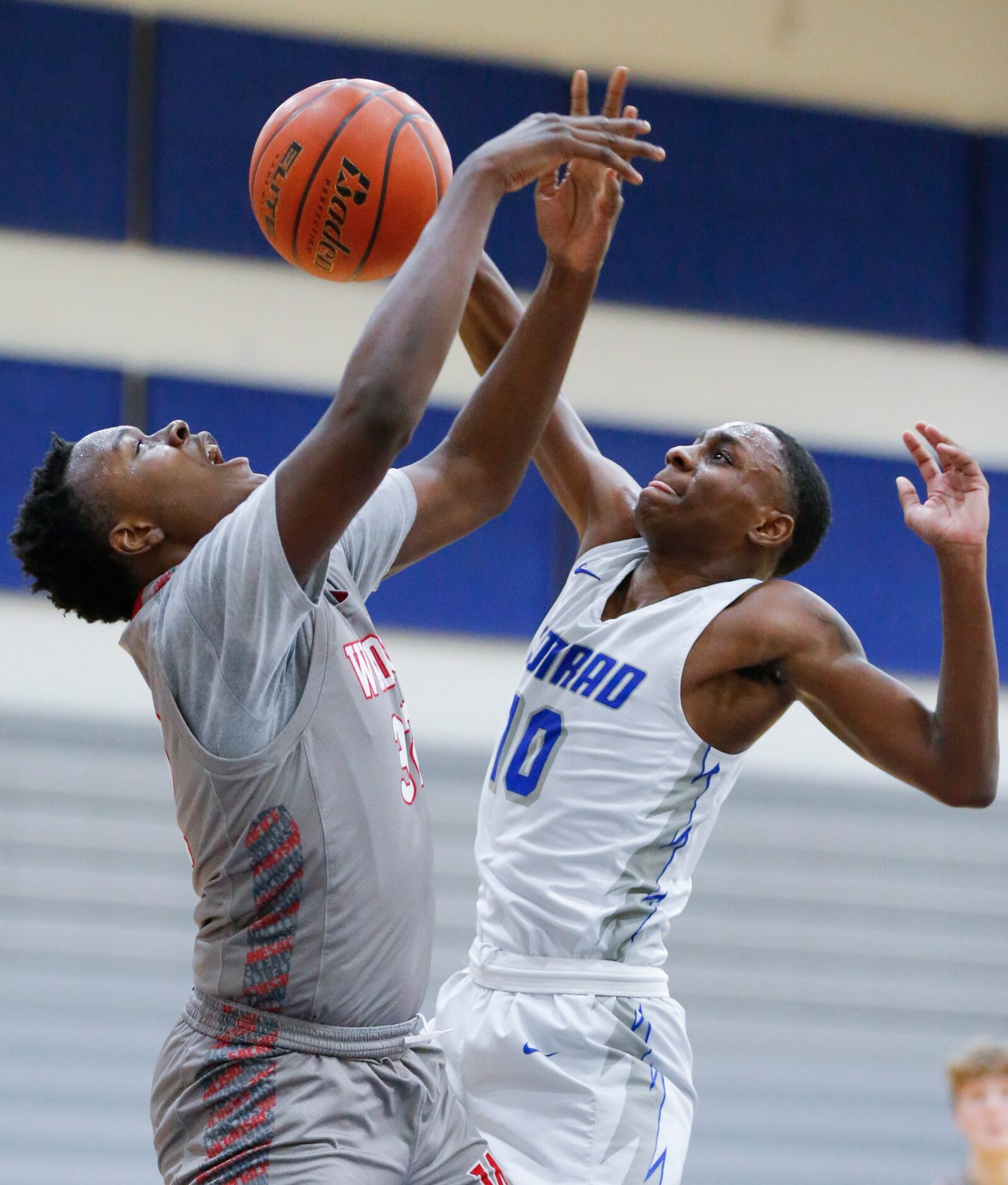 Woodrow Wilson junior forward Deshawn Jagwan, left, and Conrad senior forward Kerric...