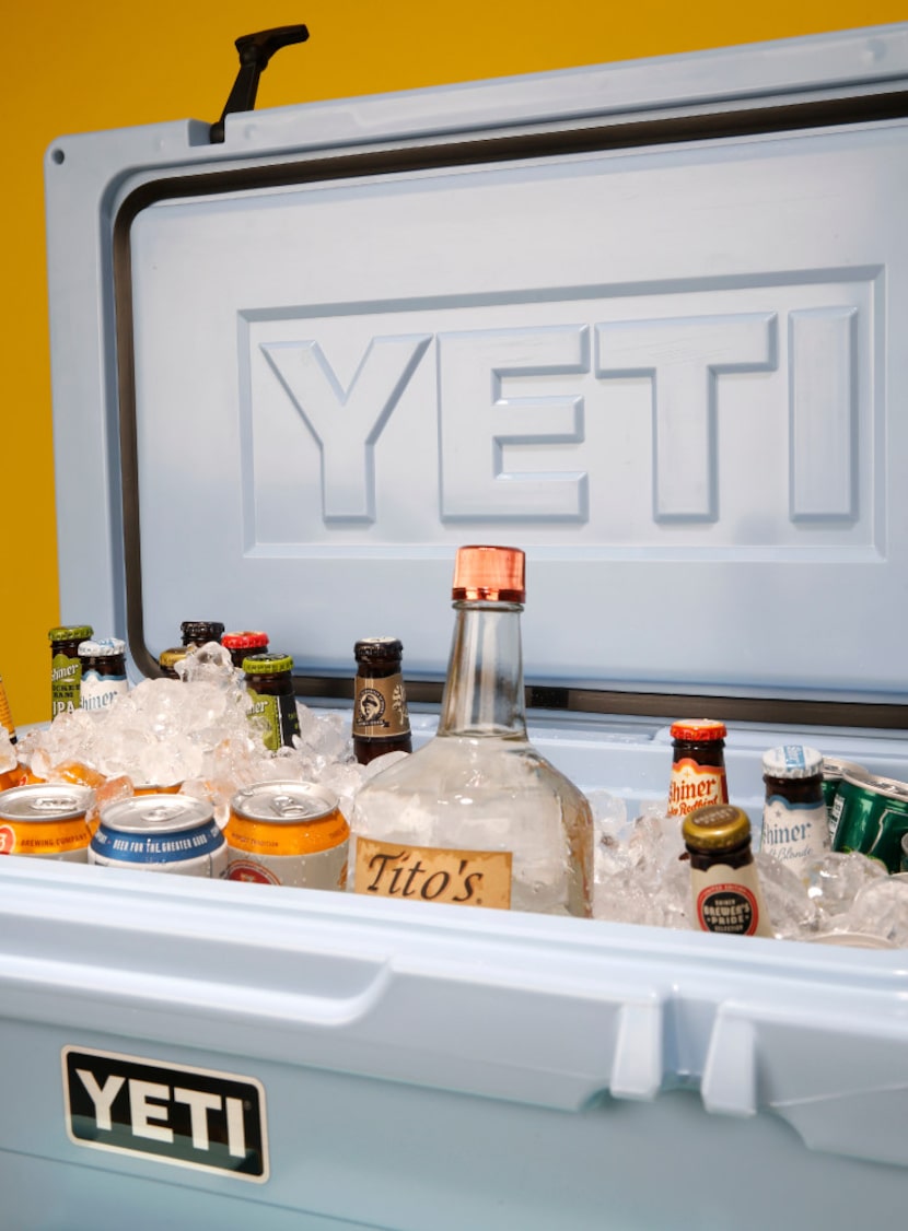 An ice blue Yeti cooler filled with Texas-made beer and vodka.