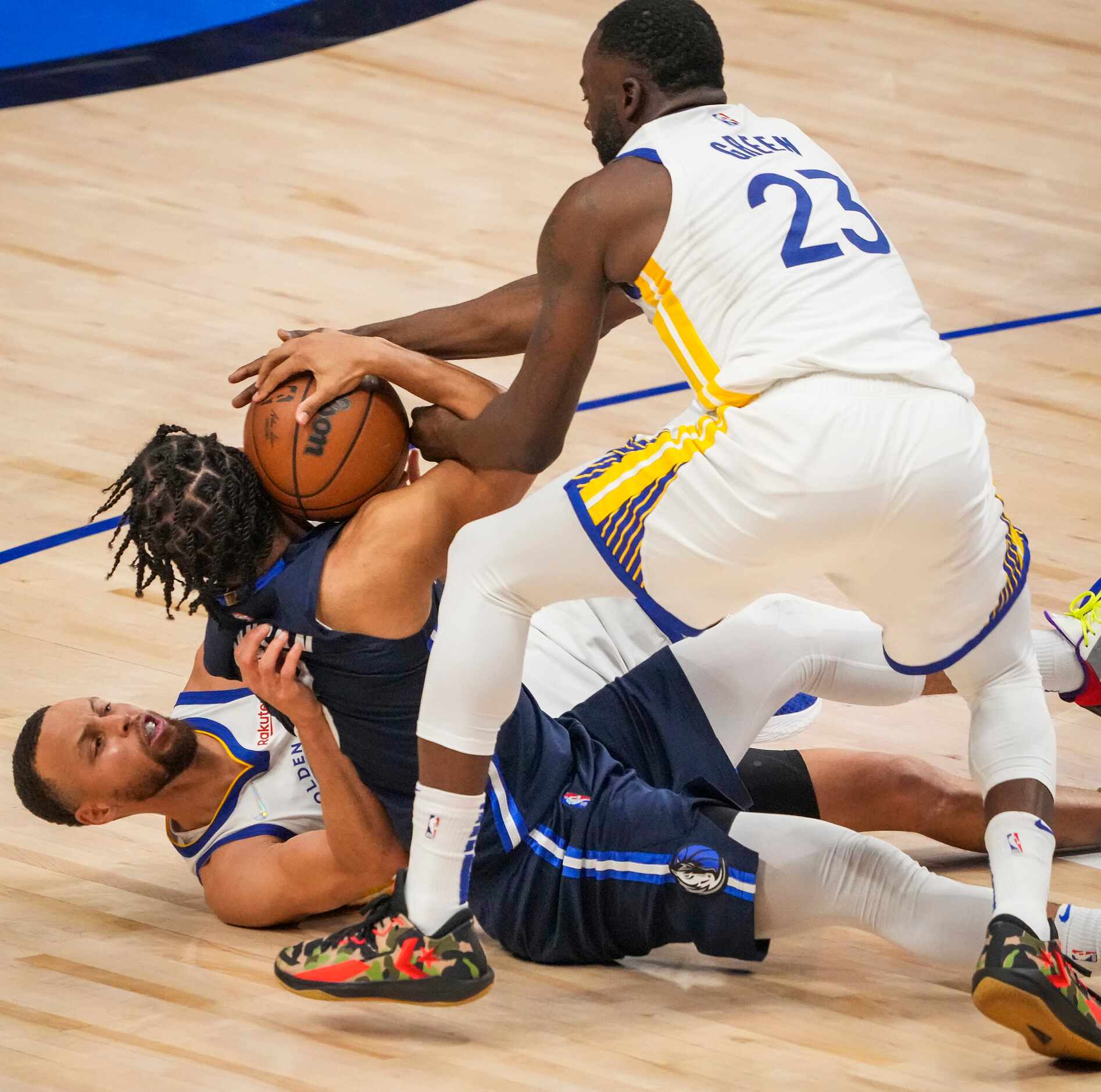 Dallas Mavericks guard Jalen Brunson (13) loses a loses a loose ball in a scramble with...