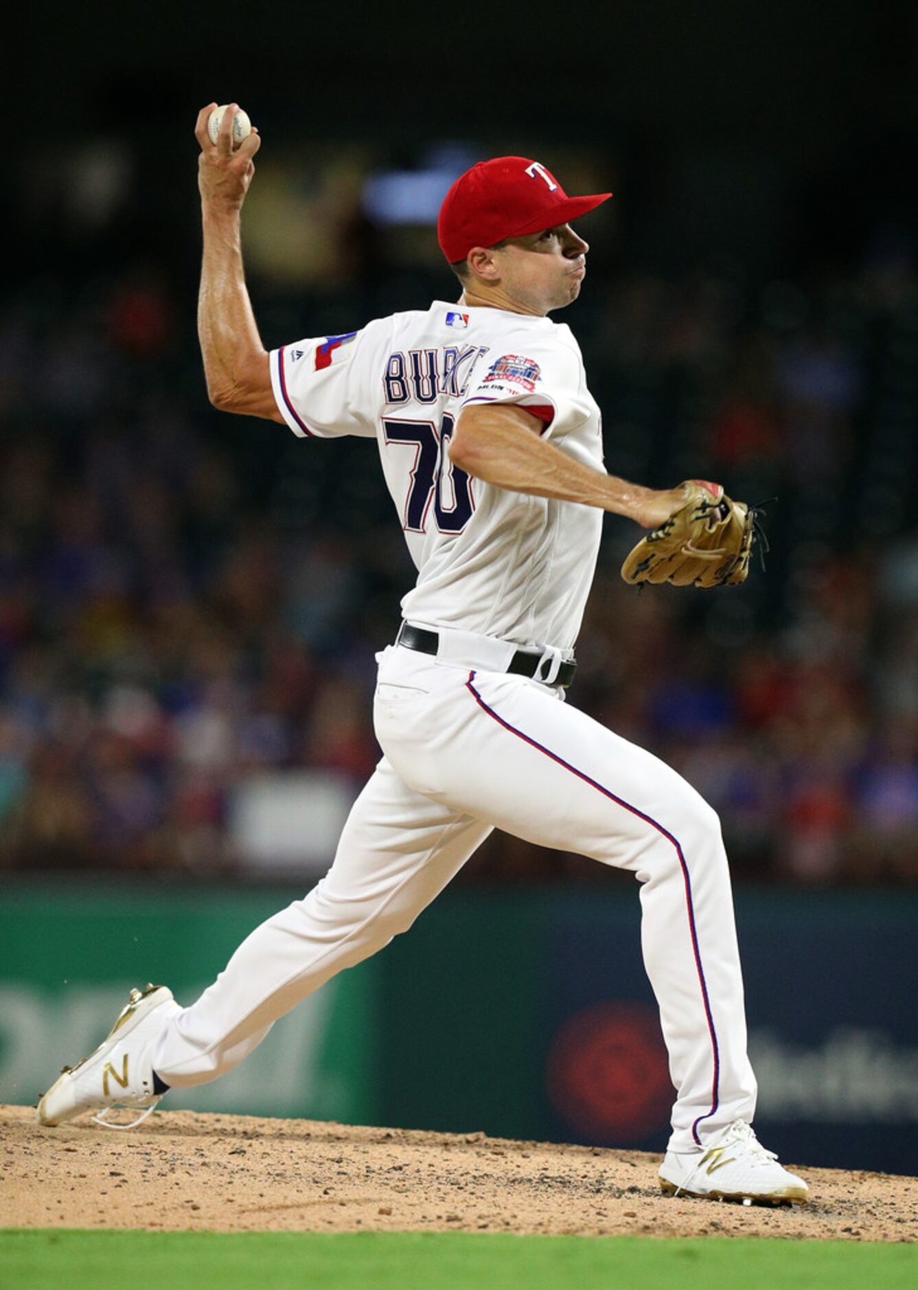 ARLINGTON, TEXAS - SEPTEMBER 13: Brock Burke #70 of the Texas Rangers pitches in the third...