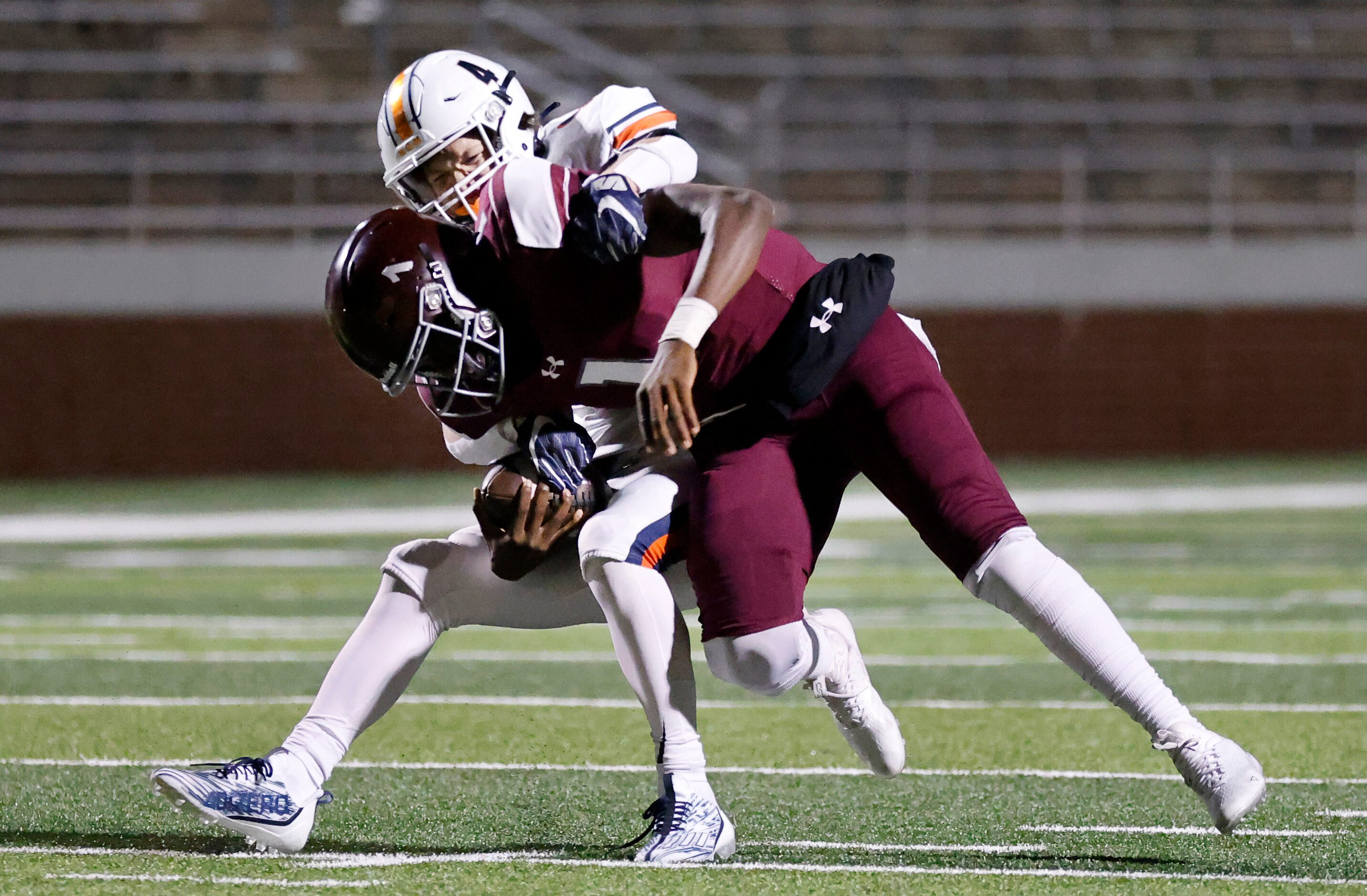 Frisco Wakeland linebacker Cooper Snyder (4) tackles Mansfield Timberview quarterback Zuric...