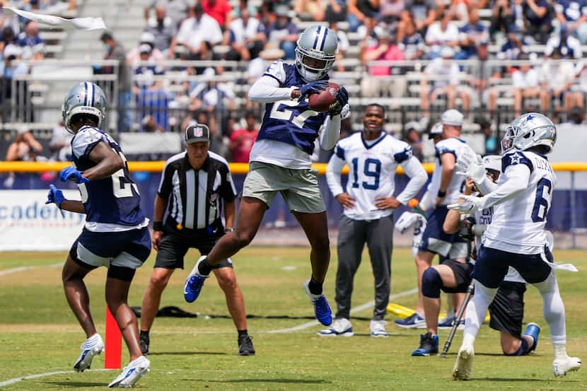 Dallas Cowboys cornerback Trevon Diggs (27) intercepts a pass intended for wide receiver...