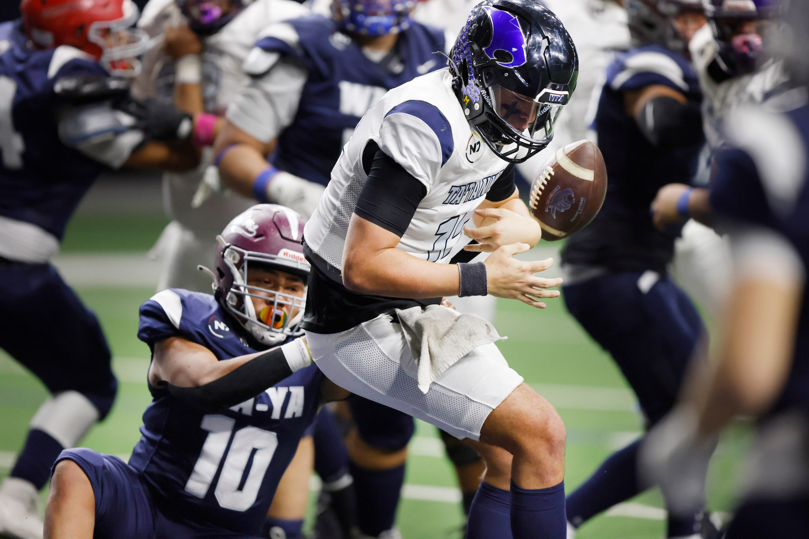 Wa-Ya’s Trajan Isaac of Spring Hill High (TN) (10) forces Ta’ Tanka quarterback Geoffery...