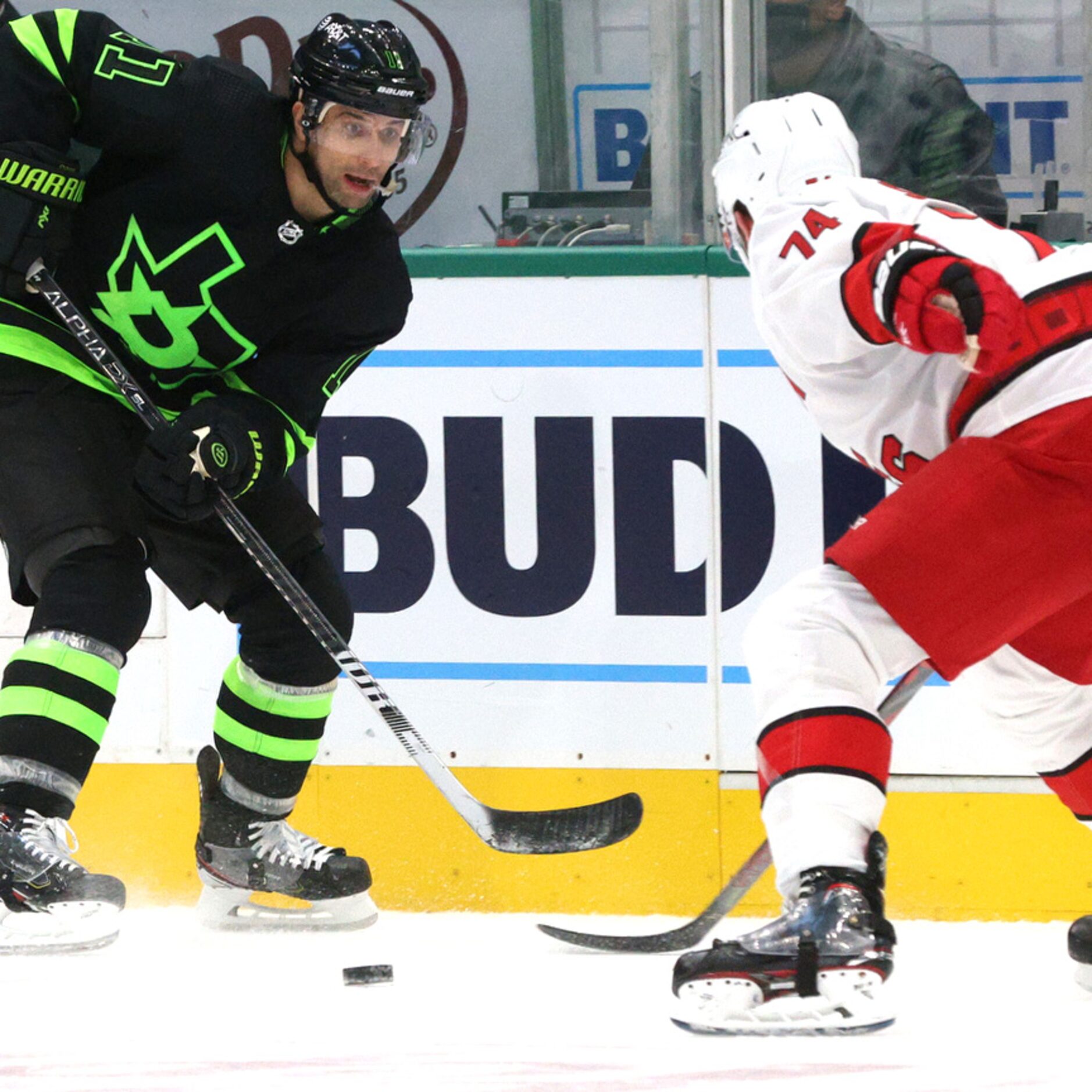 Dallas Stars center Andrew Cogliano (11) faces off against Carolina Hurricanes defenseman...