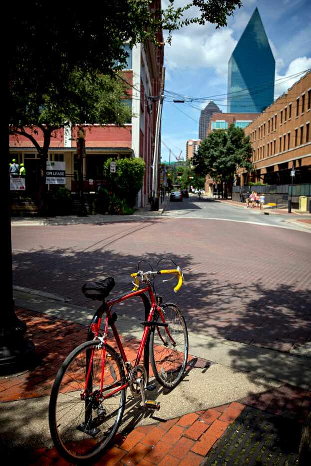 A bicycle is locked to a bike rack in the West End Wednesday, July 29, 2016 in Dallas. The...