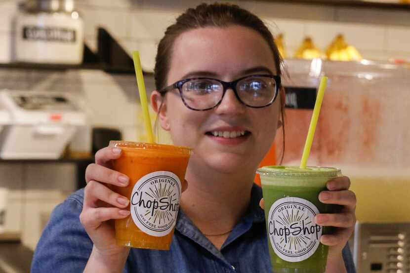 Sierra Baker hold two of the fresh juices available at the new Original ChopShop restaurant,...