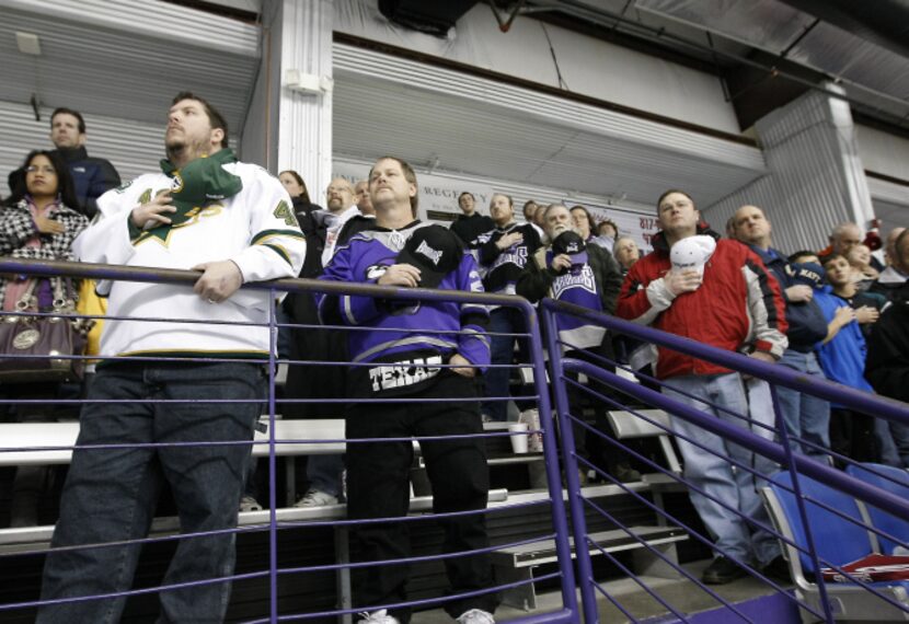 In  his Stars gear, Ryan Jordan of North Richland Hills  (left) stands at attention as the...